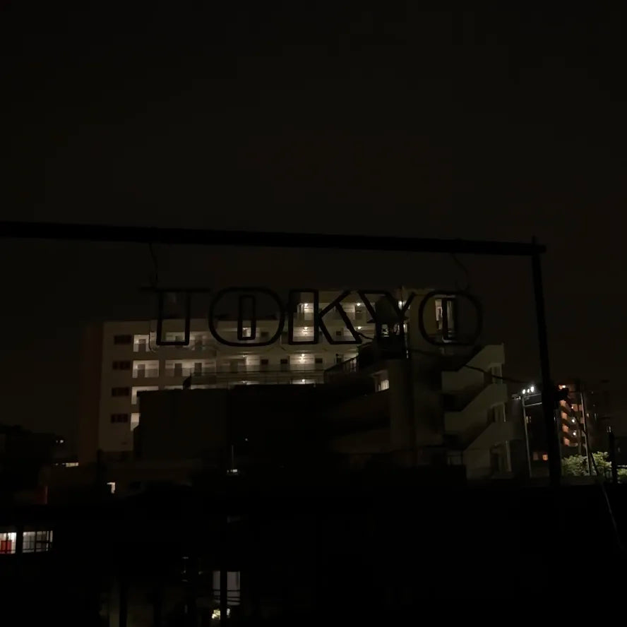 The neon signs of Tokyo are turned off