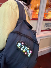 Load image into Gallery viewer, リュックにつけられた「まっちゃん」カラフルに光るワッペン