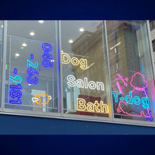 Load image into Gallery viewer, 店舗ガラスに設置されたカラフルなドッグサロンのネオンサインロゴ1
