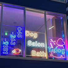 Load image into Gallery viewer, 店舗ガラスに設置されたカラフルなドッグサロンのネオンサインロゴ2
